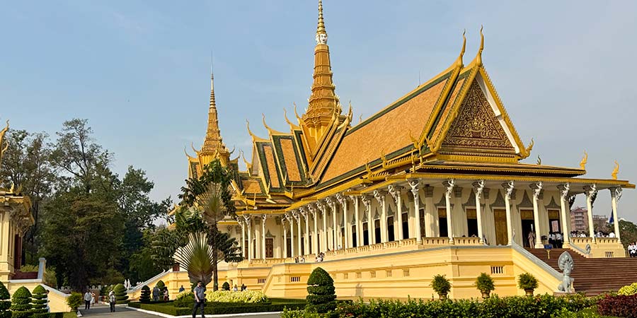 The ornate Royal Palace of Phnom Penh – this pagoda is built in a striking style with decorative trims, beautifully carved statues and bright yellow paint.